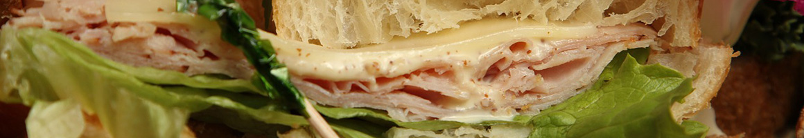Eating Deli Sandwich at Cousins Subs restaurant in Menomonee Falls, WI.